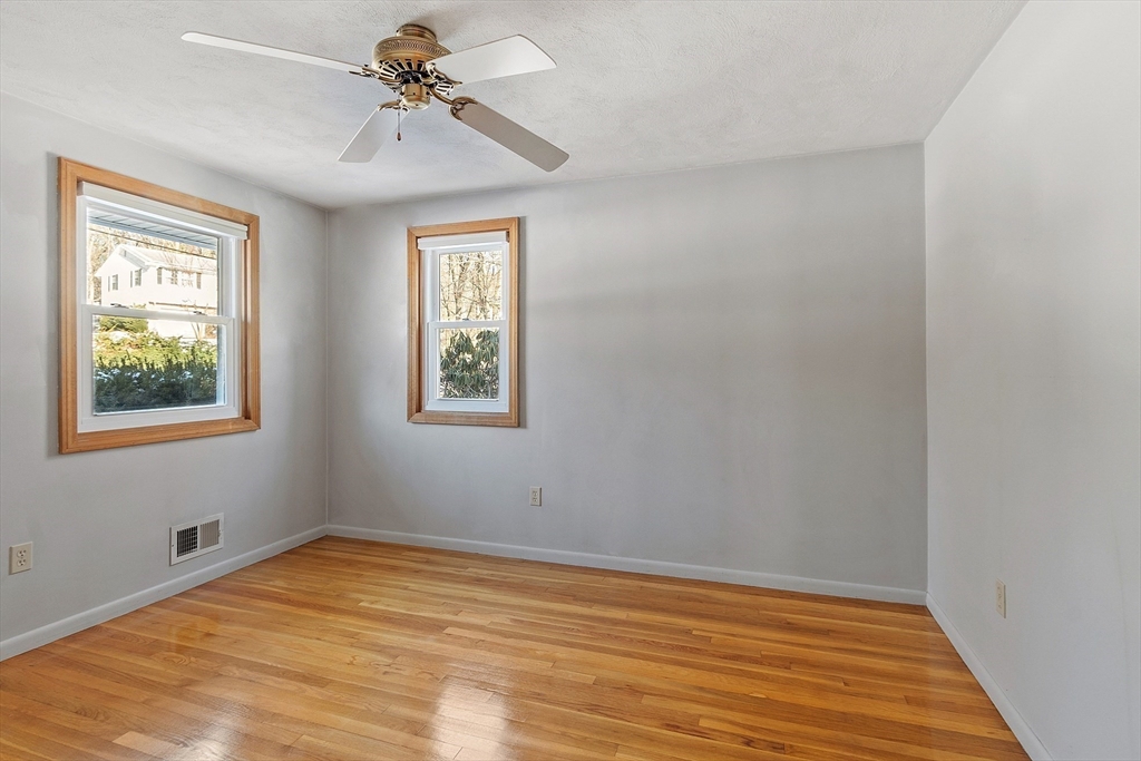 187 Mill Road Chelmsford, MA 01824 - Photo 10 of 32 a view of a room with a window and wooden floor