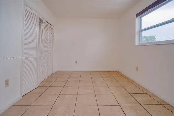a view of an empty room and window