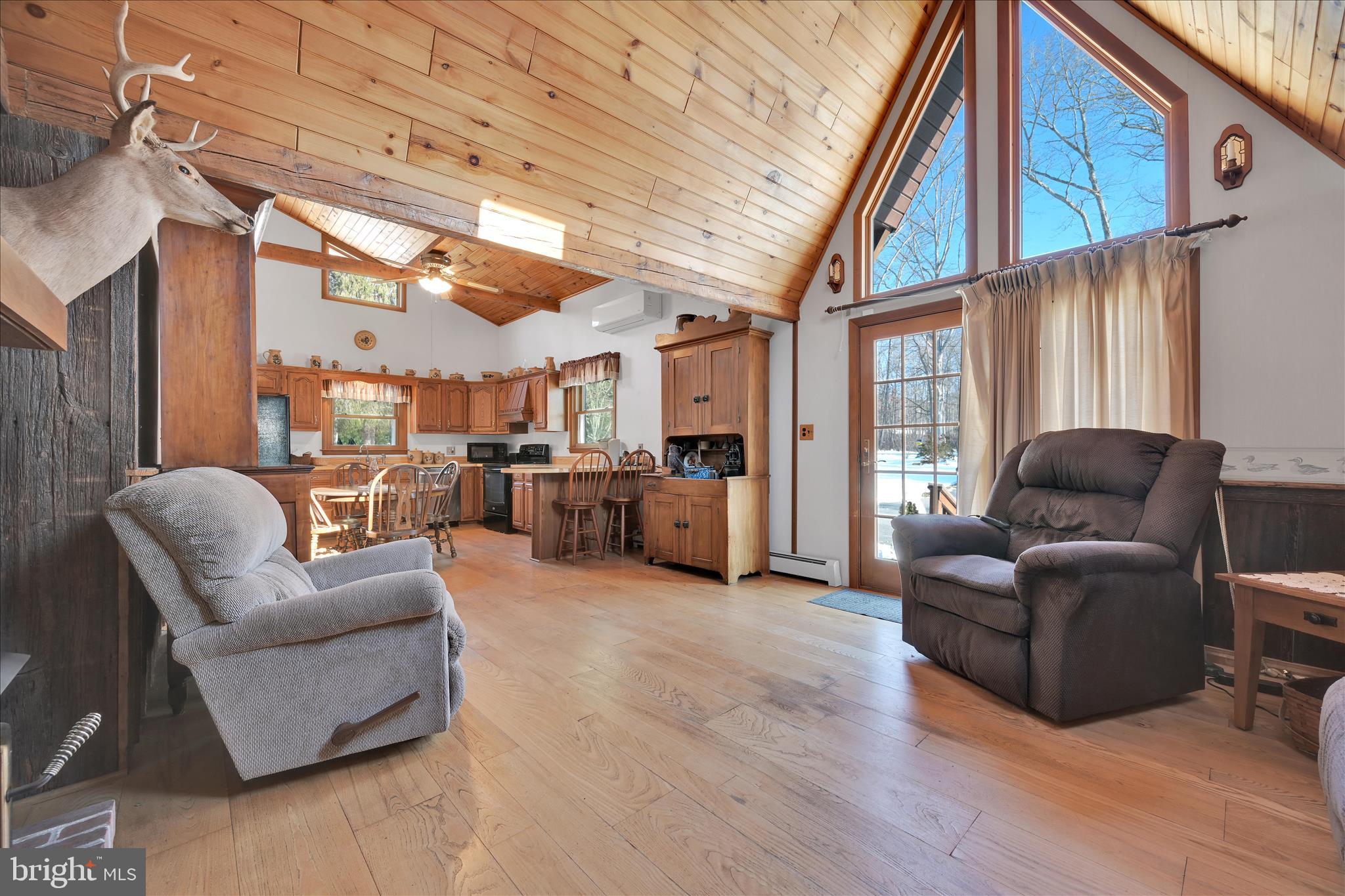 166 Camp Strauss Road Fredericksburg, PA 17026 - Photo 14 of 40 a living room with furniture a ceiling fan and a window