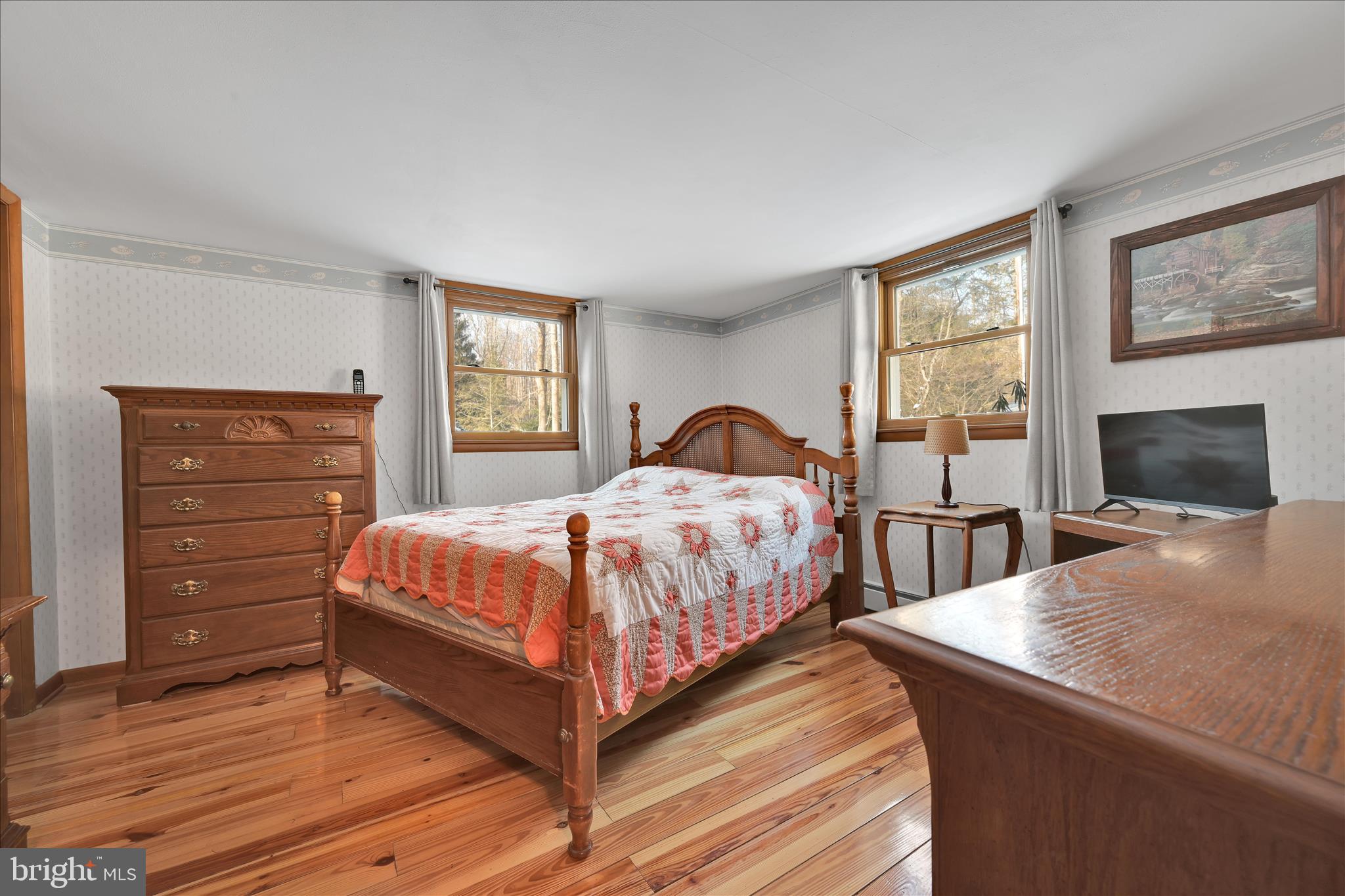 166 Camp Strauss Road Fredericksburg, PA 17026 - Photo 19 of 40 a bedroom with a bed and a flat screen tv