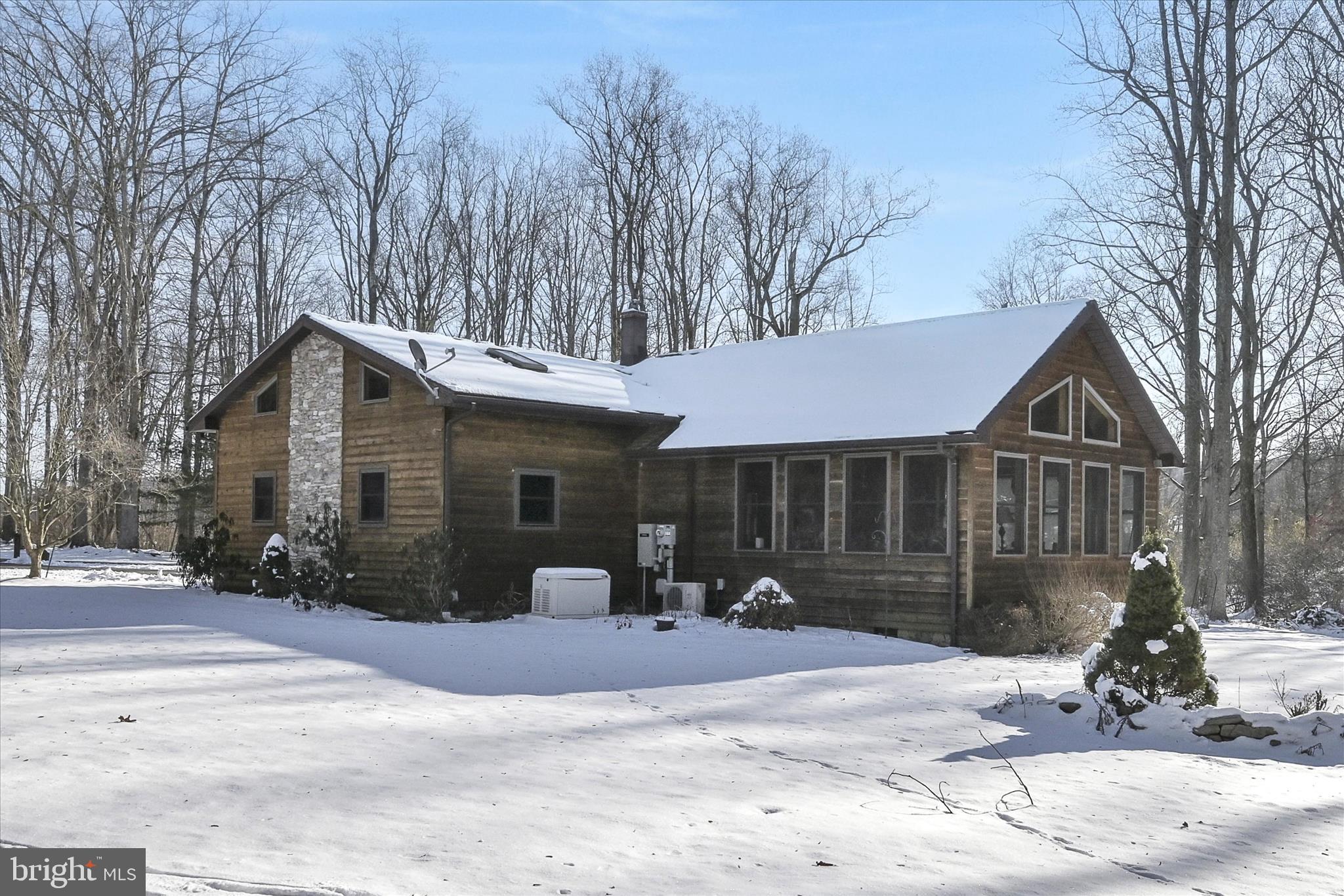 166 Camp Strauss Road Fredericksburg, PA 17026 - Photo 2 of 40 a front view of a house with a yard and garage