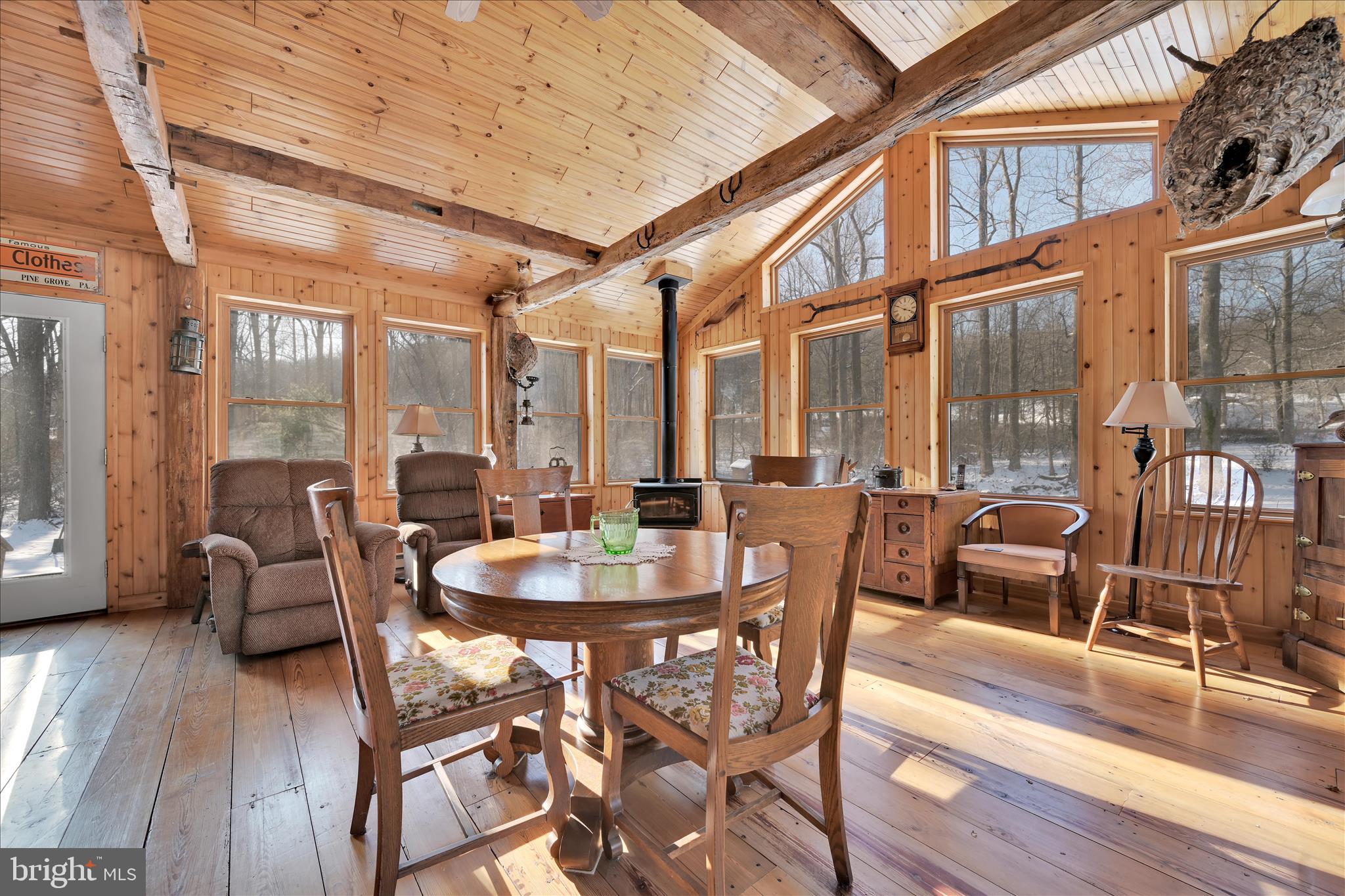 166 Camp Strauss Road Fredericksburg, PA 17026 - Photo 22 of 40 a dining room with furniture a chandelier and wooden floor