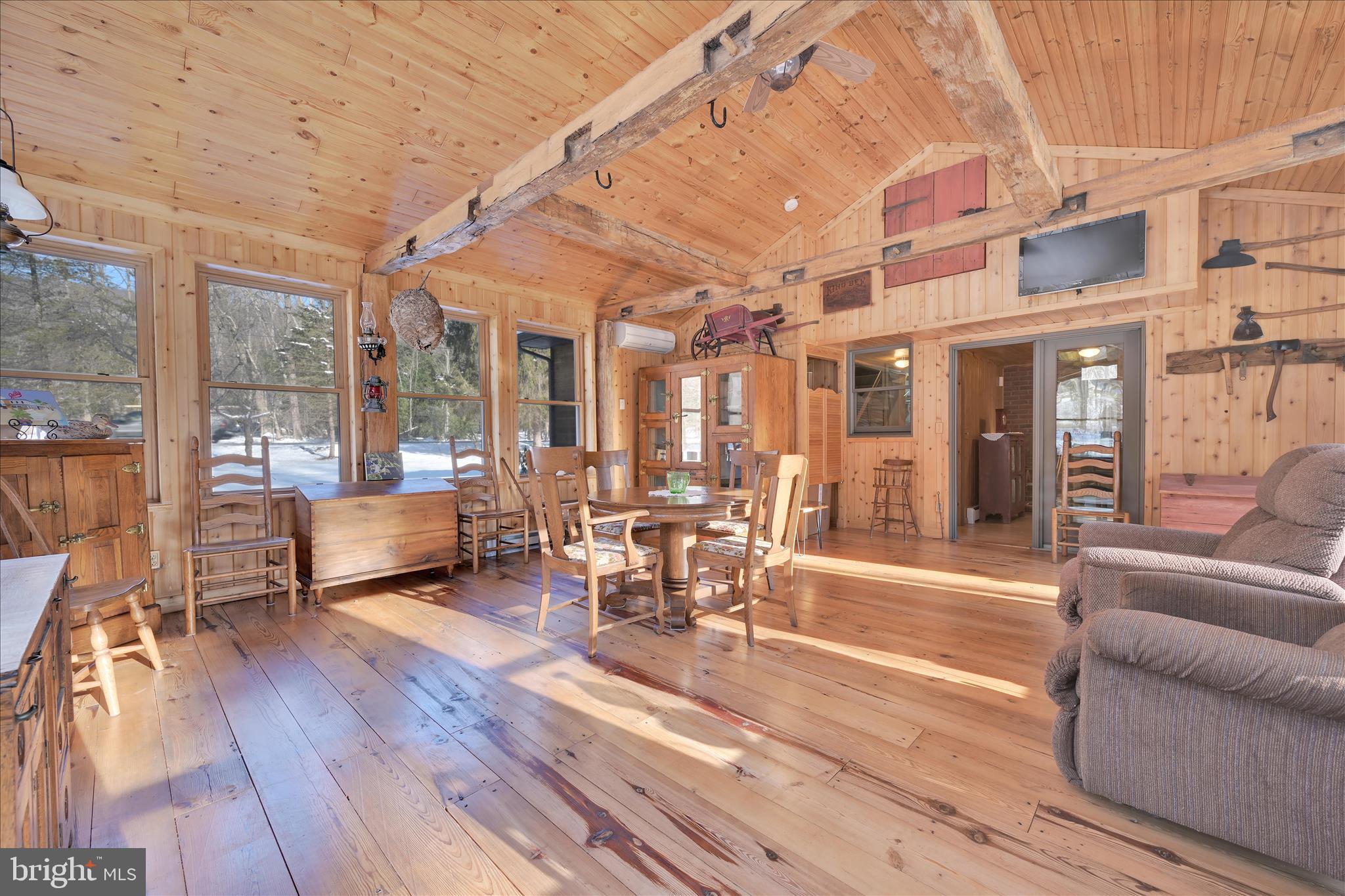 166 Camp Strauss Road Fredericksburg, PA 17026 - Photo 23 of 40 a living room with furniture a table and chairs