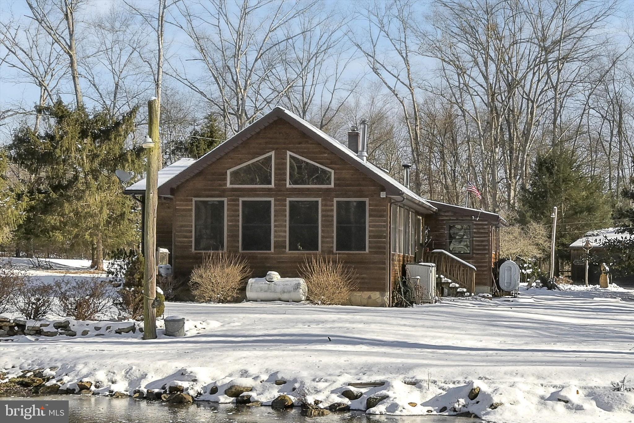 166 Camp Strauss Road Fredericksburg, PA 17026 - Photo 5 of 40 a front view of a house with a yard
