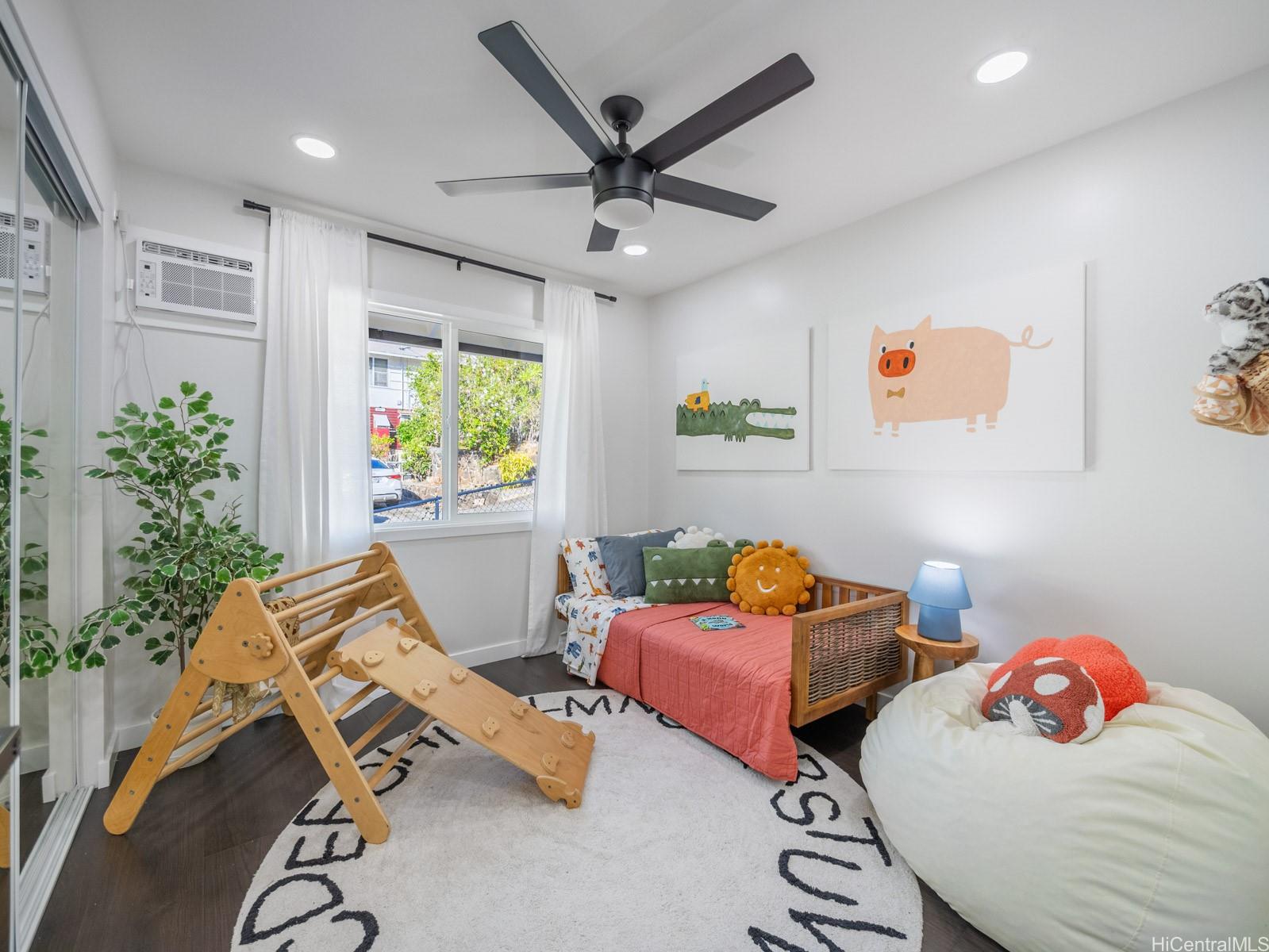 1843 A 10th Avenue Honolulu, HI 96816 - Photo 13 of 22 a bedroom with furniture and a window