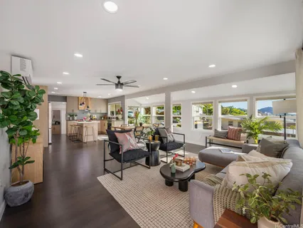 a living room with furniture and a large window