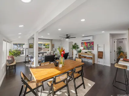 a view of a dining room with furniture wooden floor and a rug