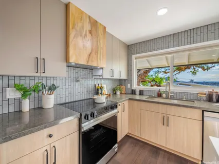 a kitchen with sink and cabinets