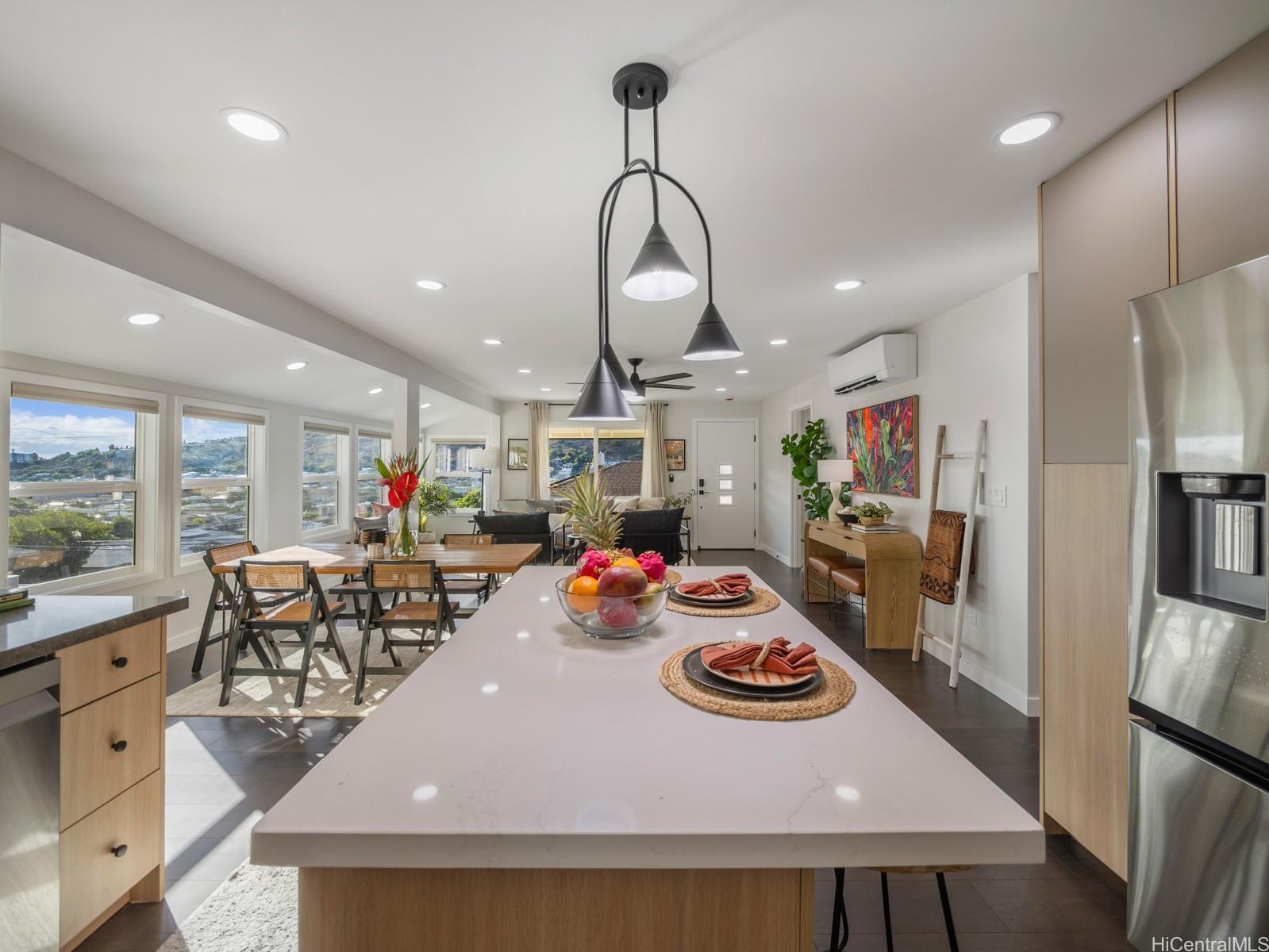 1843 A 10th Avenue Honolulu, HI 96816 - Photo 10 of 22 a view of a dining room and livingroom with furniture wooden floor a chandelier