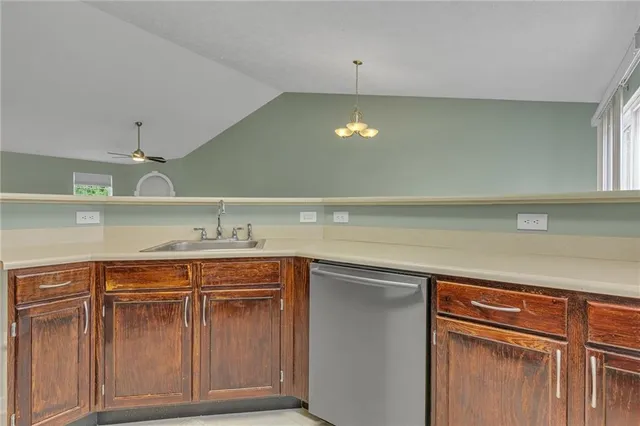 a view of a kitchen with a sink and cabinets