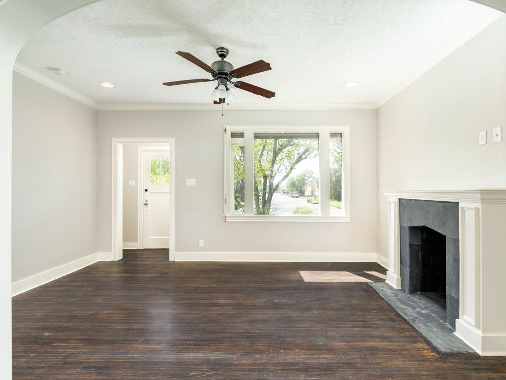 4528 Avenue R 1/2 Galveston, TX 77551 - Photo 10 of 22 a view of an empty room with window and wooden floor