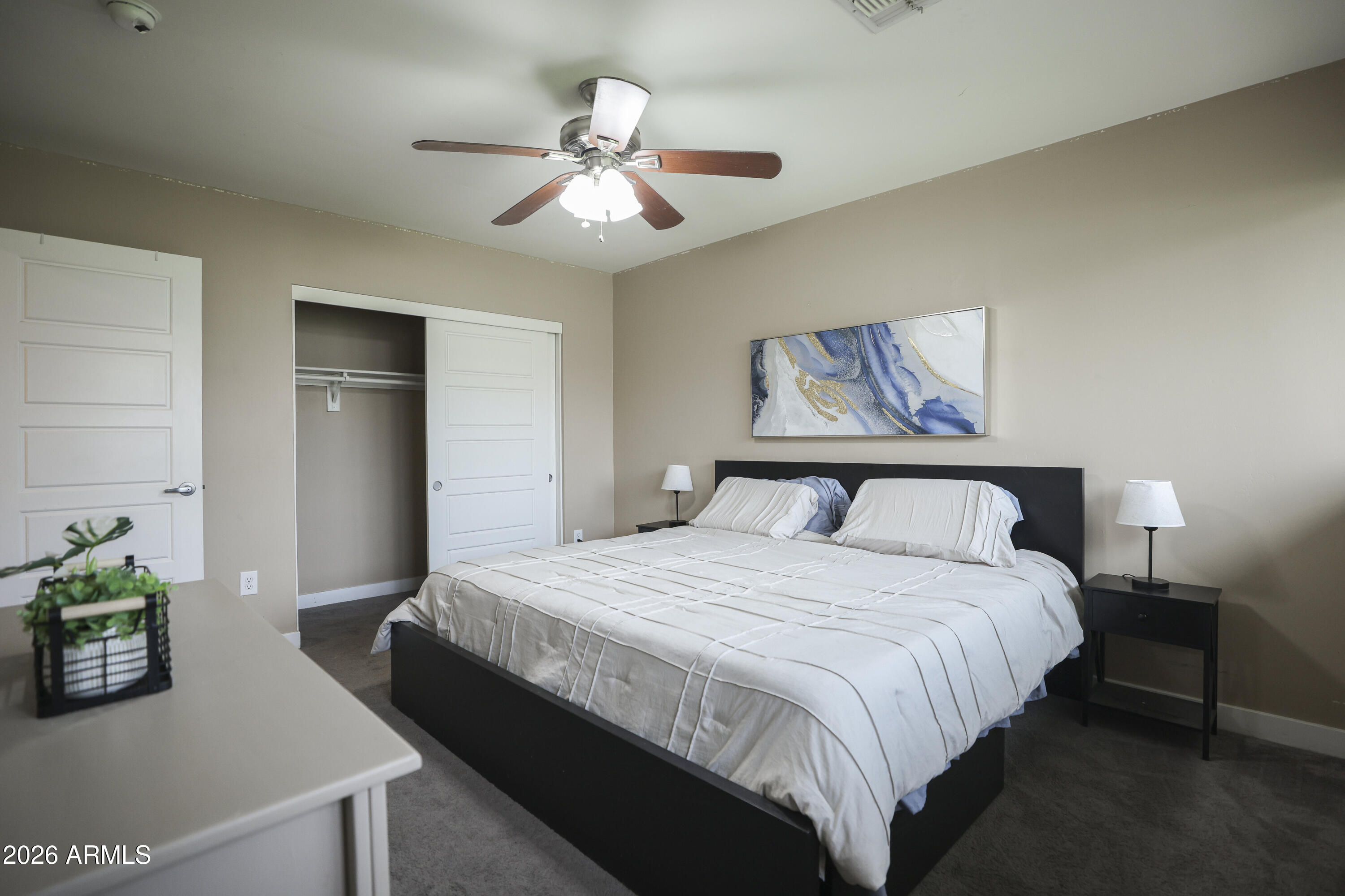 925 West McDowell Road, Unit 108 Phoenix, AZ 85007 - Photo 12 of 22 a bedroom with bed and a chandelier