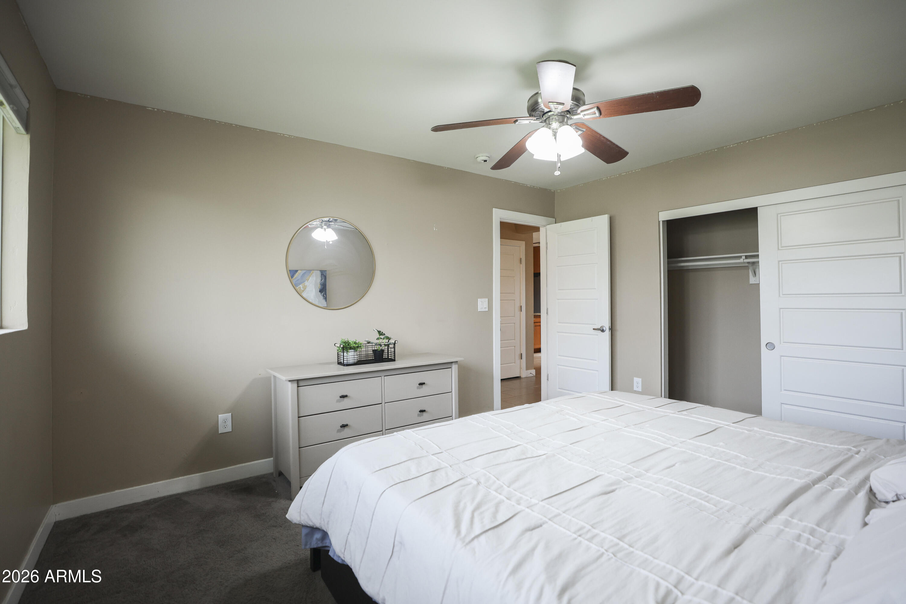 925 West McDowell Road, Unit 108 Phoenix, AZ 85007 - Photo 13 of 22 a bedroom with a bed and a chandelier