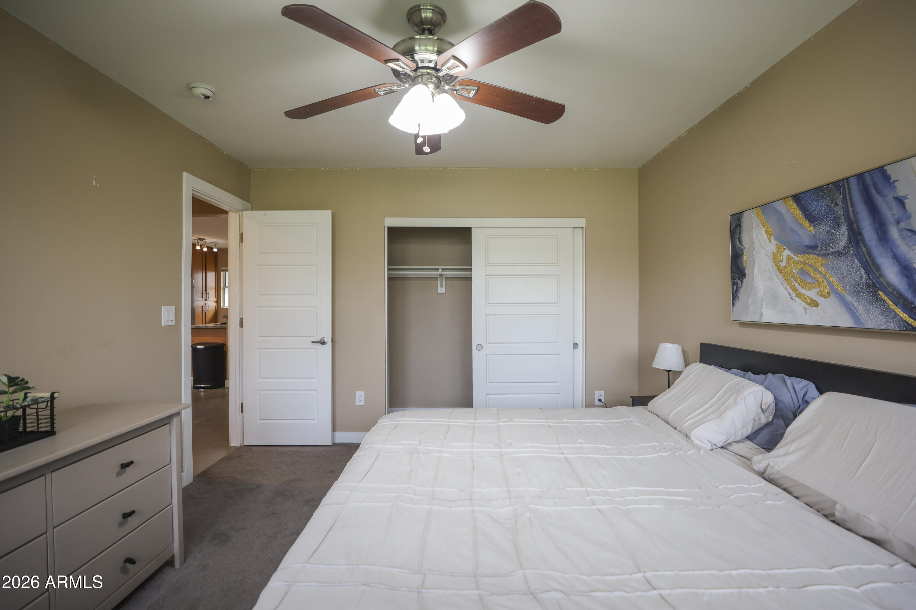 925 West McDowell Road, Unit 108 Phoenix, AZ 85007 - Photo 14 of 22 a bedroom with a large bed and a chandelier