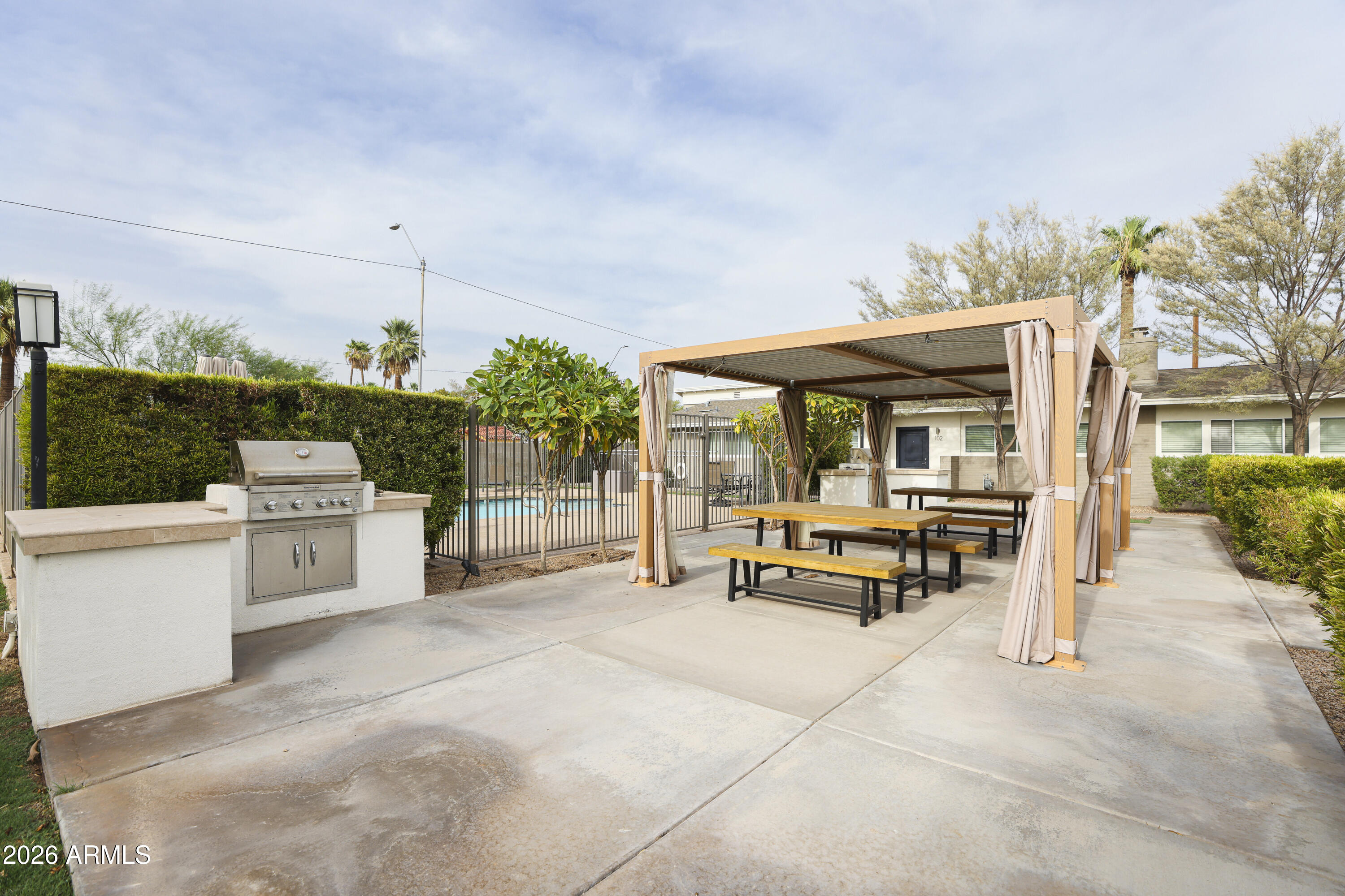 925 West McDowell Road, Unit 108 Phoenix, AZ 85007 - Photo 21 of 22 a view of a terrace with sitting area