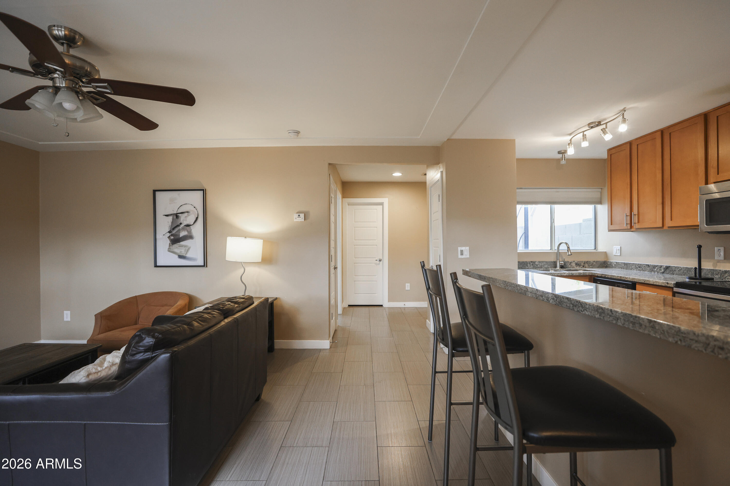 925 West McDowell Road, Unit 108 Phoenix, AZ 85007 - Photo 7 of 22 a dining room with furniture and a window