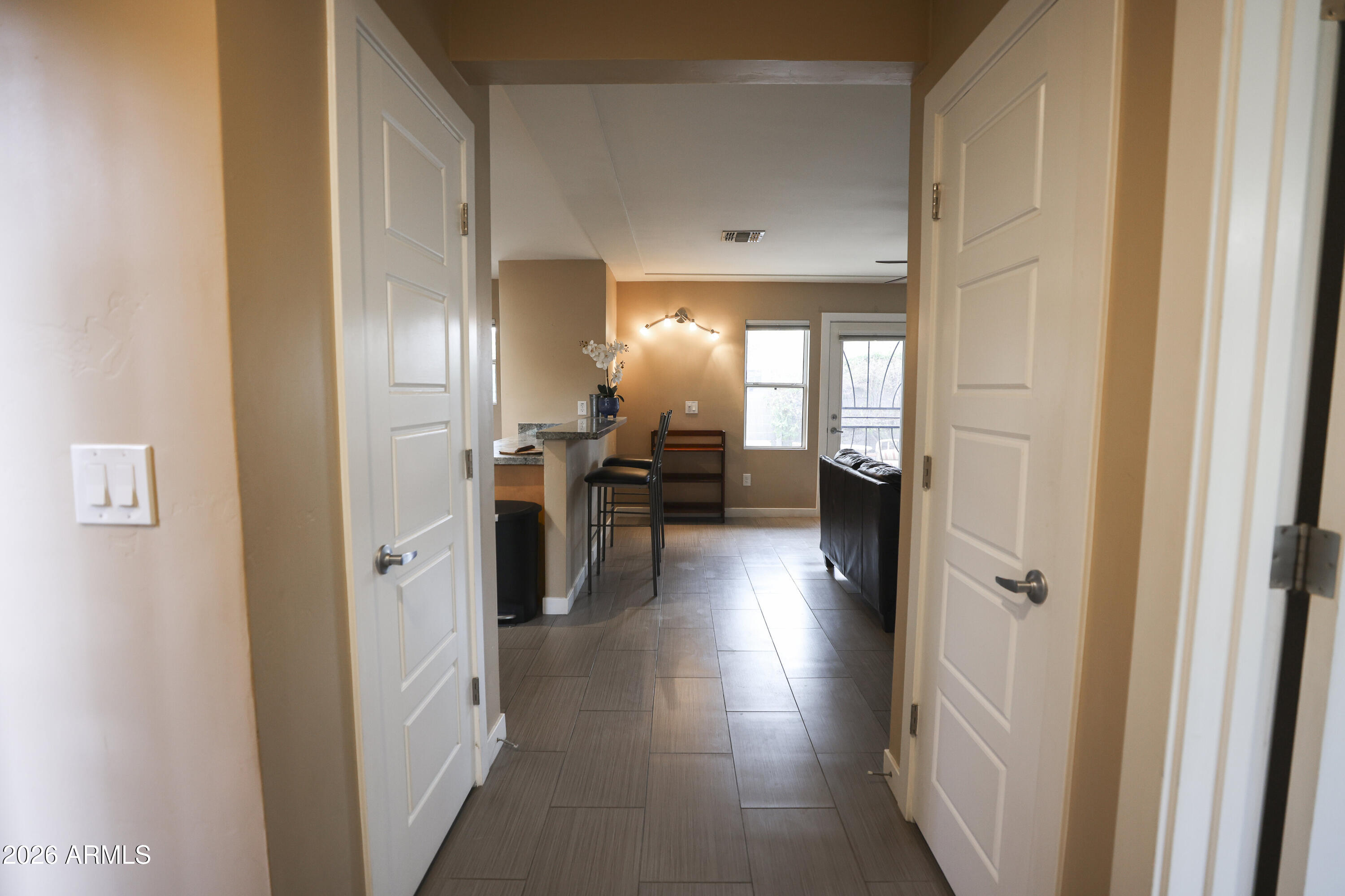 925 West McDowell Road, Unit 108 Phoenix, AZ 85007 - Photo 9 of 22 a view of a hallway with livingroom and furniture