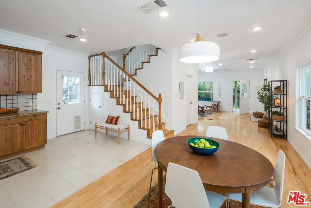 3421 Ferncroft Road Los Angeles, CA 90039 - Photo 2 of 35 a view of kitchen and dining room with furniture a rug and wooden floor