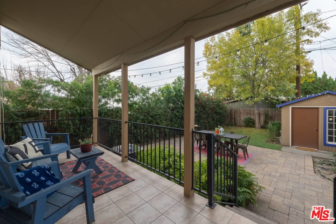 3421 Ferncroft Road Los Angeles, CA 90039 - Photo 29 of 35 a view of a patio with a table chairs and a backyard