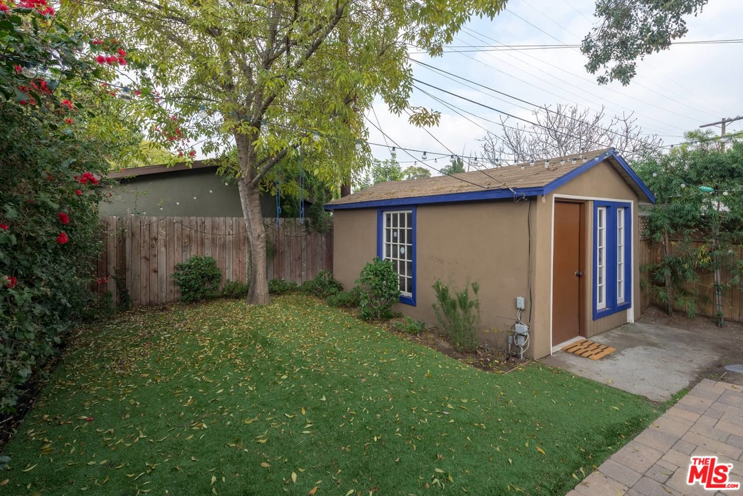 3421 Ferncroft Road Los Angeles, CA 90039 - Photo 32 of 35 a view of a wooden house with a yard and large trees