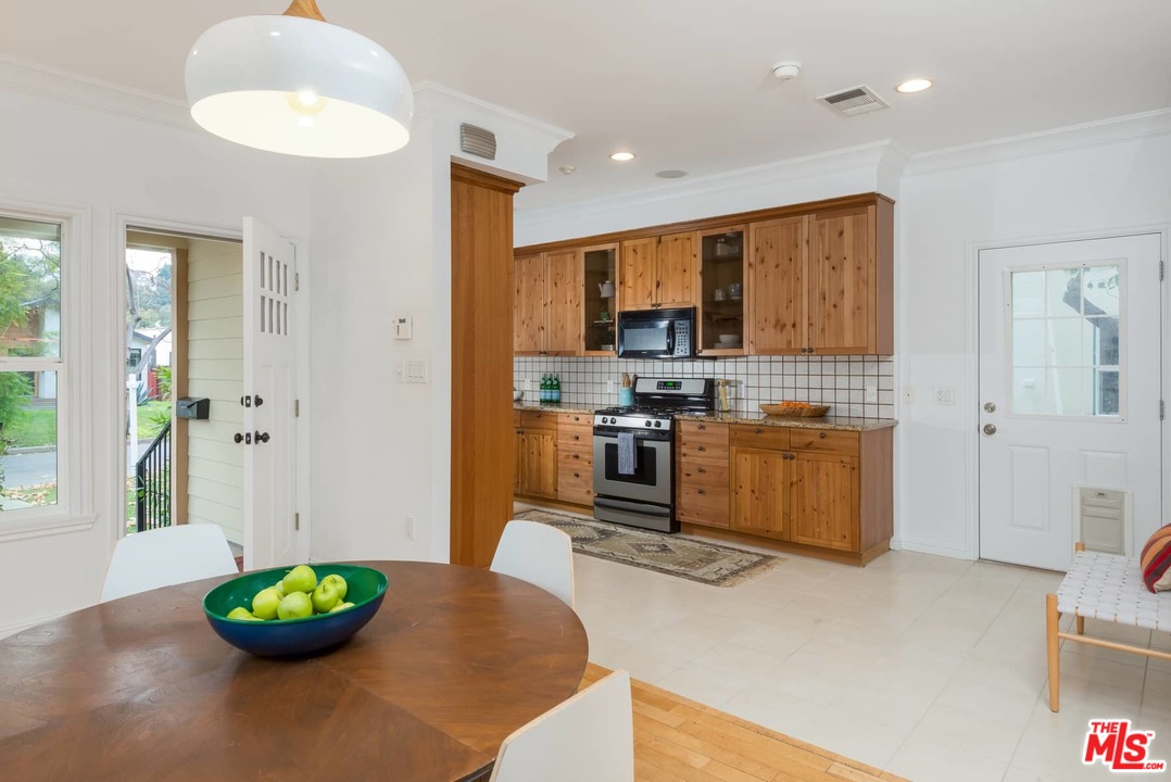 3421 Ferncroft Road Los Angeles, CA 90039 - Photo 5 of 35 a living room with stainless steel appliances furniture a window and a kitchen view
