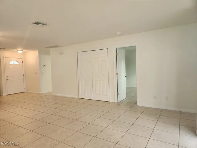 an empty room with fan