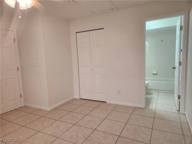 a view of an empty room and closet