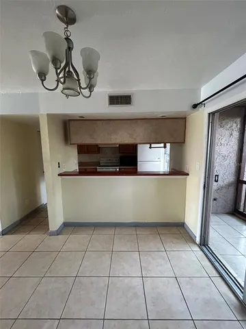 a kitchen with a cabinets and window