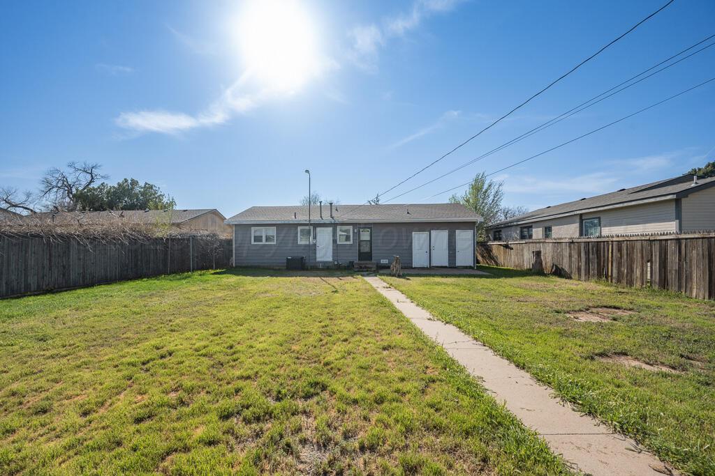 2909 South Marrs Street Amarillo, TX 79103 - Photo 17 of 21 a swimming pool with outdoor seating and yard
