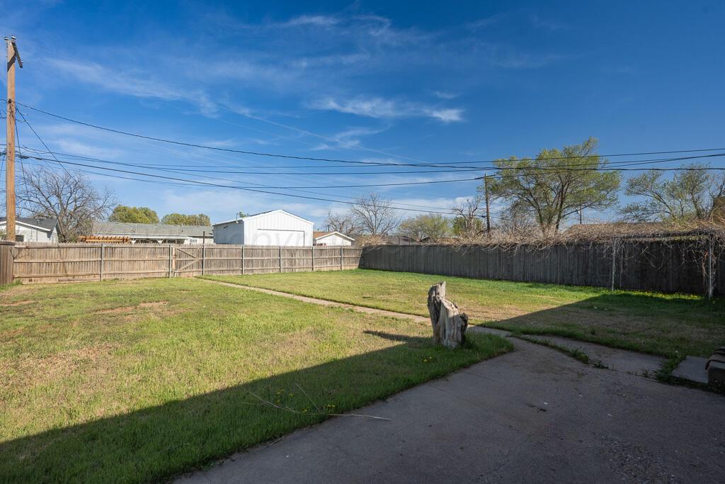 2909 South Marrs Street Amarillo, TX 79103 - Photo 19 of 21 a view of a swimming pool with a yard