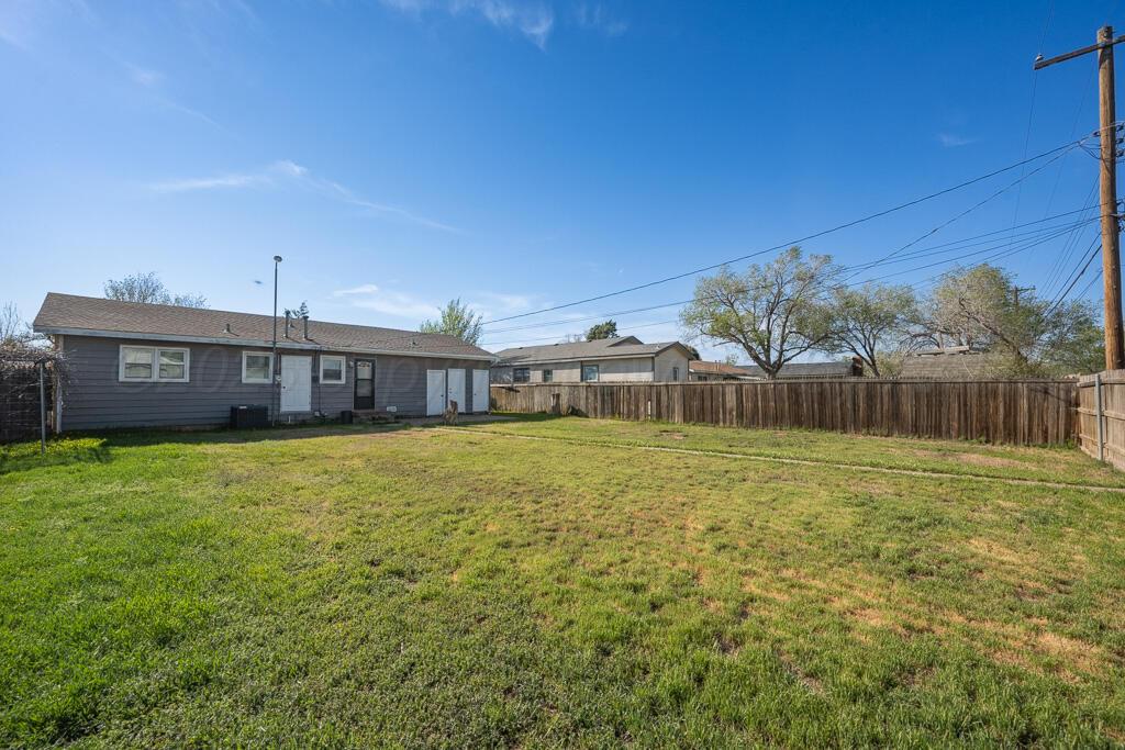2909 South Marrs Street Amarillo, TX 79103 - Photo 20 of 21 a front view of a house with a garden