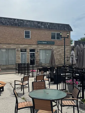 a view of a dinning table and chairs in the patio
