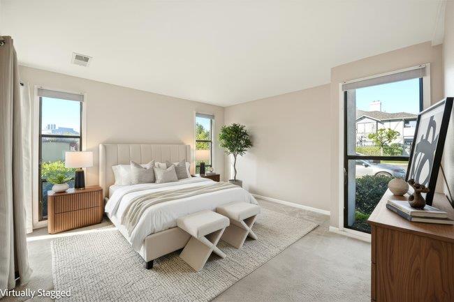 1067 Padre Drive, Unit 2 Salinas, CA 93901 - Photo 12 of 24 a bedroom with a large bed and a couch