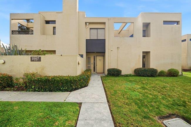 1067 Padre Drive, Unit 2 Salinas, CA 93901 - Photo 2 of 24 a front view of a house with a yard and lake view
