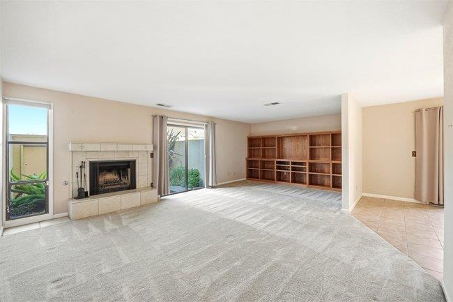 1067 Padre Drive, Unit 2 Salinas, CA 93901 - Photo 4 of 24 an empty room with windows and fireplace