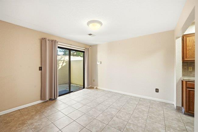 1067 Padre Drive, Unit 2 Salinas, CA 93901 - Photo 7 of 24 a view of an empty room with window and a kitchen