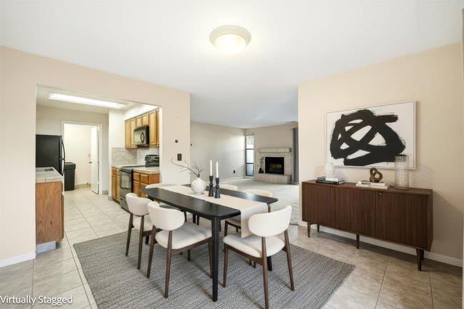 1067 Padre Drive, Unit 2 Salinas, CA 93901 - Photo 9 of 24 a view of a dining room with furniture and wooden floor