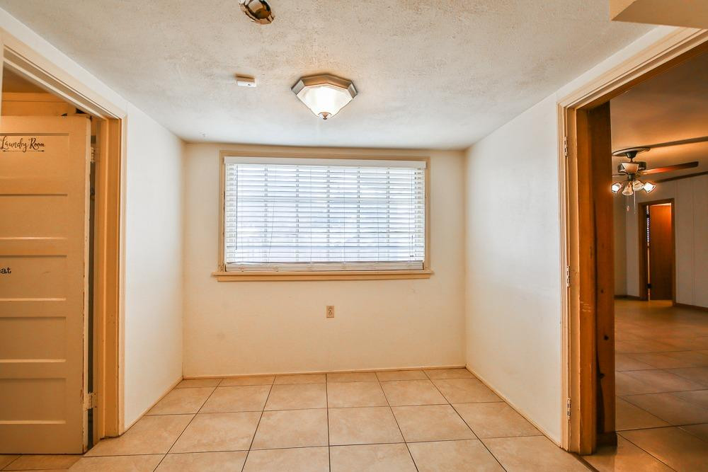 2318 29th Street Lubbock, TX 79411 - Photo 11 of 32 a view of an empty room and window