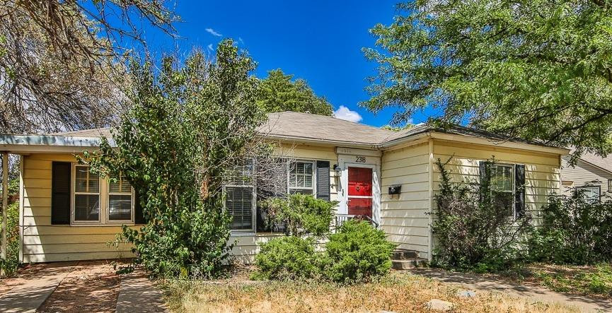 2318 29th Street Lubbock, TX 79411 - Photo 2 of 32 a front view of a house with garden