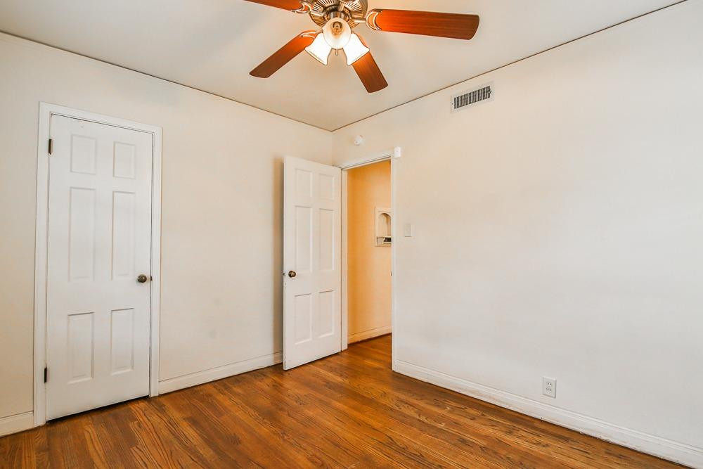 2318 29th Street Lubbock, TX 79411 - Photo 25 of 32 a view of an empty room with wooden floor