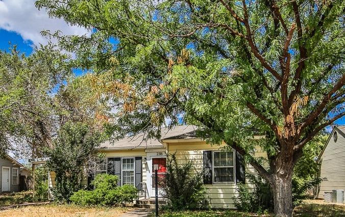 2318 29th Street Lubbock, TX 79411 - Photo 32 of 32 front view of a house with a tree