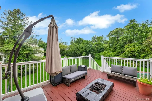 a view of a deck with furniture