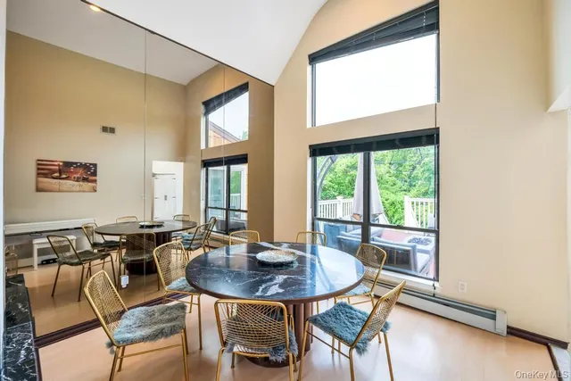 a dining room with furniture and wooden floor