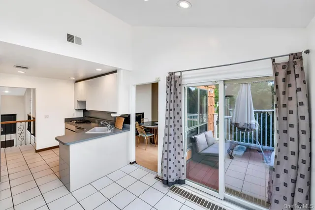 a kitchen with stainless steel appliances granite countertop a stove and a refrigerator