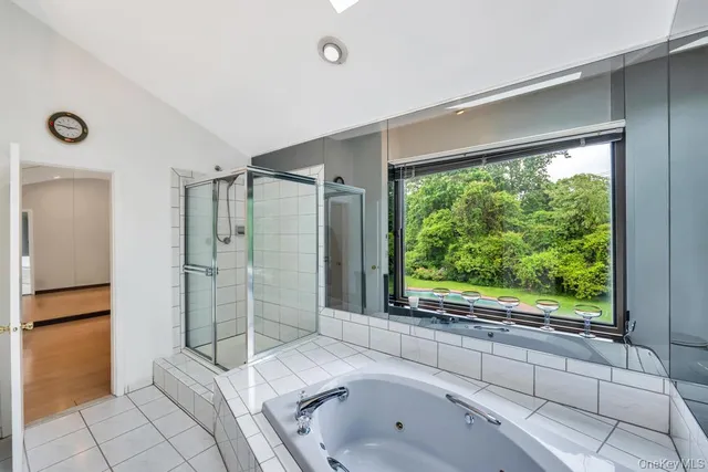 a bathroom with a tub shower and sink