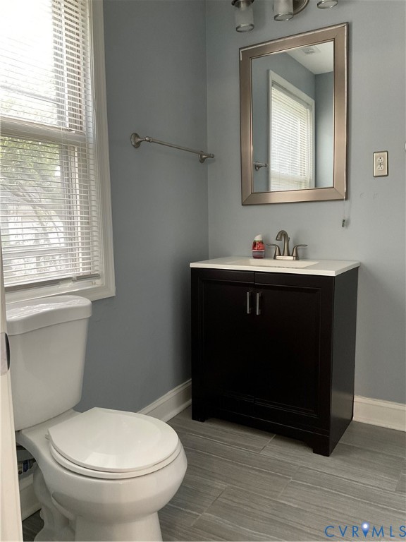 621 Fairlie Road Colonial Heights, VA 23834 - Photo 10 of 14 Modern vanity with a white countertop and dark woo