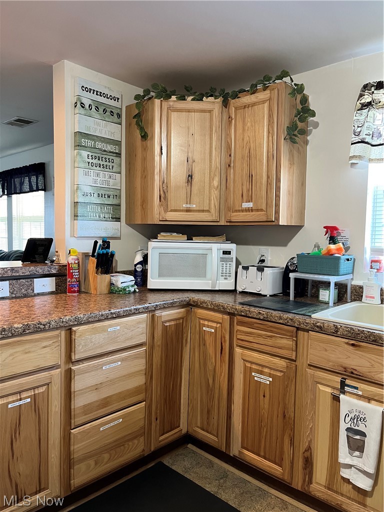 4972 West Fremont Road Port Clinton, OH 43452 - Photo 7 of 29 Kitchen with plenty of natural light and sink