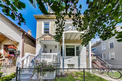 a view of houses with a yard