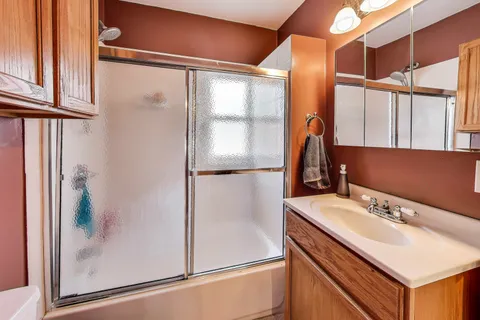 a bathroom with a sink and mirror