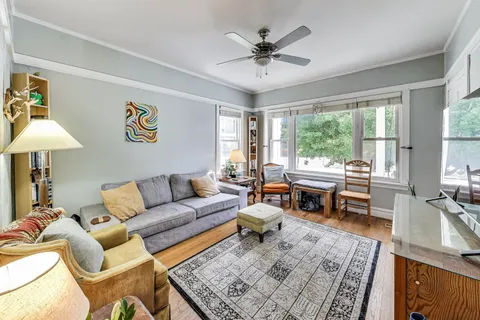 a living room with furniture and a rug